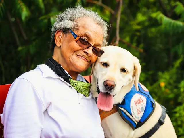 Senior woman with her loved service dog.